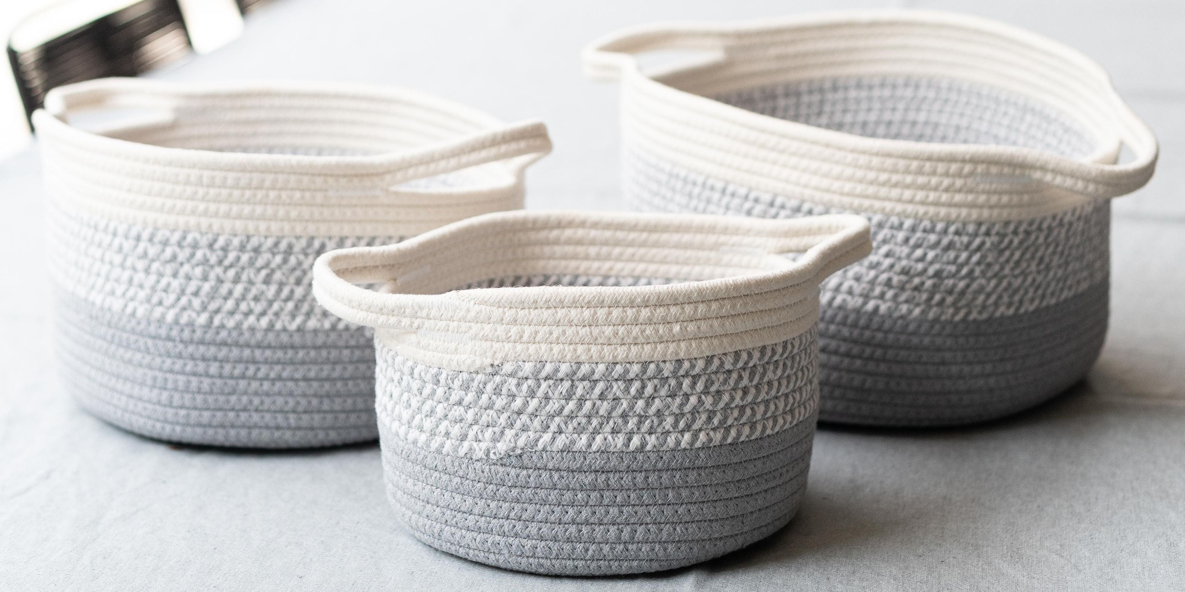 A set of grey ombre cotton baskets raning from small, medium, large.